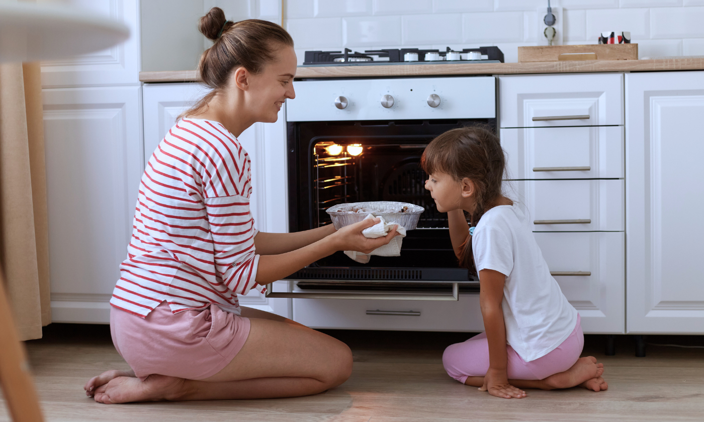 mom and daughter using gas stove safely